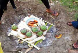 A lovo: preparing food in a hole in the ground